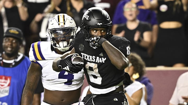 Oct 26, 2024; College Station, Texas, USA; Texas A&M Aggies running back Le'Veon Moss (8) reacts against the LSU Tigers during the third quarter. The Aggies defeated the Tigers 38-23; at Kyle Field. Mandatory Credit: Maria Lysaker-Imagn Images. Oct 26, 2024; College Station, Texas, USA; Texas A&M Aggies running back Le'Veon Moss (8) reacts against the LSU Tigers during the third quarter. The Aggies defeated the Tigers 38-23; at Kyle Field. Mandatory Credit: Maria Lysaker-Imagn Images.
