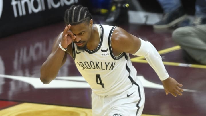 Mar 10, 2024; Cleveland, Ohio, USA; Brooklyn Nets guard Dennis Smith Jr. (4) celebrates his three-point basket in the fourth quarter against the Cleveland Cavaliers at Rocket Mortgage FieldHouse. Mandatory Credit: David Richard-Imagn Images