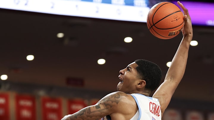 Jan 13, 2026; Houston, Texas, USA; Houston Cougars center Chris Cenac Jr. (5) dunks against West Virginia Mountaineers in the first half at Fertitta Center. Mandatory Credit: Thomas Shea-Imagn Images