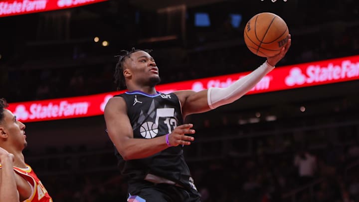 Apr 6, 2025; Atlanta, Georgia, USA; Utah Jazz guard Isaiah Collier (13) shoots against the Atlanta Hawks in the third quarter at State Farm Arena. Mandatory Credit: Brett Davis-Imagn Images