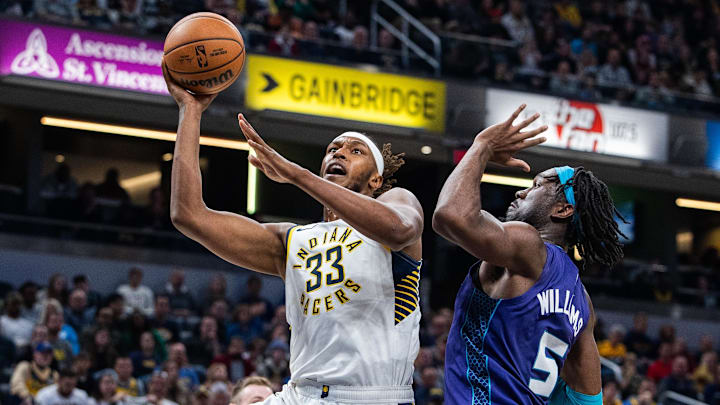 Nov 4, 2023; Indianapolis, Indiana, USA; Indiana Pacers center Myles Turner (33) shoots the ball while Charlotte Hornets center Mark Williams (5) defends in the second half at Gainbridge Fieldhouse. Mandatory Credit: Trevor Ruszkowski-Imagn Images