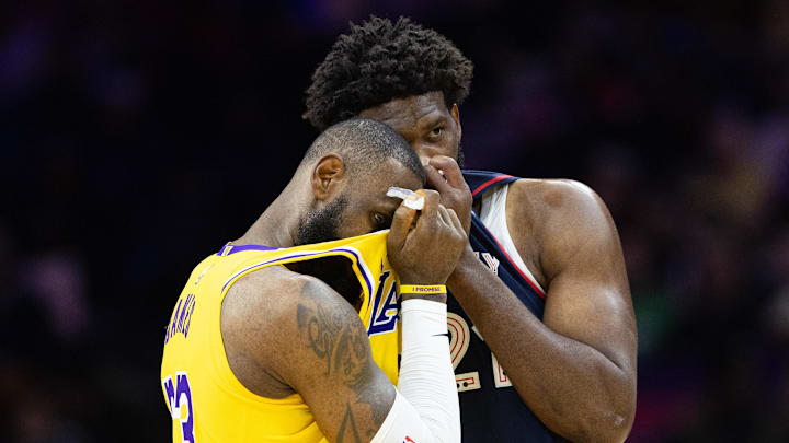 Nov 27, 2023; Philadelphia, Pennsylvania, USA: Philadelphia 76ers center Joel Embiid (21) talks with Los Angeles Lakers forward LeBron James (23) during the second quarter at Wells Fargo Center. Mandatory Credit: Bill Streicher-Imagn Images Nov 27, 2023; Philadelphia, Pennsylvania, USA: Philadelphia 76ers center Joel Embiid (21) talks with Los Angeles Lakers forward LeBron James (23) during the second quarter at Wells Fargo Center. Mandatory Credit: Bill Streicher-Imagn Images