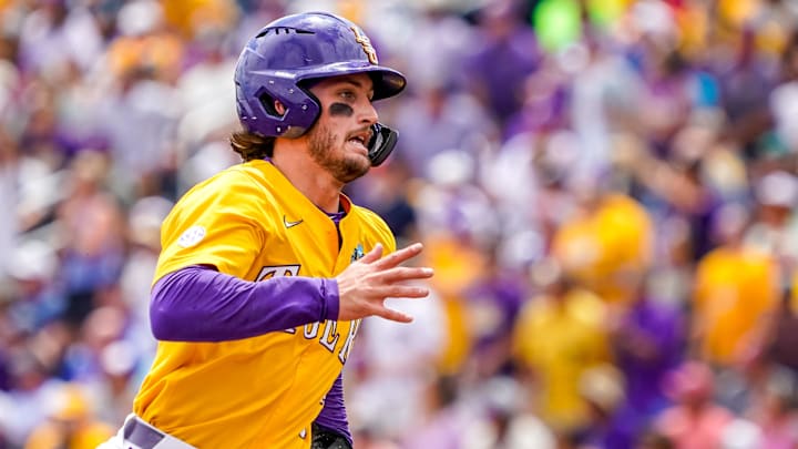 Jun 25, 2023; Omaha, NE, USA; LSU Tigers center fielder Dylan Crews (3) rounds third while running