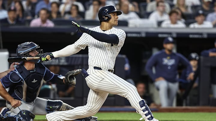 Jul 19, 2024; Bronx, New York, USA;  New York Yankees right fielder Juan Soto (22) hits a double in the fourth inning against the Tampa Bay Rays at Yankee Stadium. Mandatory Credit: Wendell Cruz-USA TODAY Sports