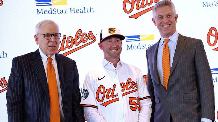 Nov 4, 2025; Baltimore, MD, USA; From left to right: Baltimore Orioles Owner David Rubenstein, Baltimore Orioles Manager Craig Albernaz and President of Baseball Operations Mike Elias pose for a photo during a press conference at Warehouse Bar. Mandatory Credit: Daniel Kucin Jr.-Imagn Images