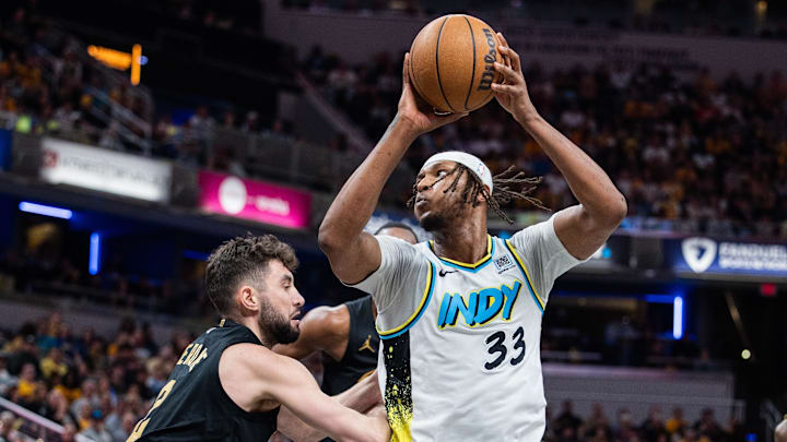 May 11, 2025; Indianapolis, Indiana, USA; Indiana Pacers center Myles Turner (33) shoots the ball while Cleveland Cavaliers guard Ty Jerome (2) defends during game four of the second round for the 2025 NBA Playoffs at Gainbridge Fieldhouse. Mandatory Credit: Trevor Ruszkowski-Imagn Images