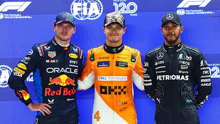 Pole position qualifier Lando Norris of Great Britain and McLaren, Second placed qualifier Max Verstappen of the Netherlands and Oracle Red Bull Racing and Third placed qualifier Lewis Hamilton of Great Britain and Mercedes pose for a photo in parc ferme during qualifying ahead of the F1 Grand Prix of Singapore at Marina Bay Street Circuit on September 21, 2024 in Singapore, Singapore. (Photo by Mark Thompson/Getty Images)