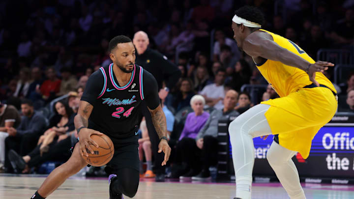 Dec 27, 2025; Miami, Florida, USA; Miami Heat guard Norman Powell (24) drives to the basket against Indiana Pacers forward Pascal Siakam (43) during the second half at Kaseya Center. Mandatory Credit: Sam Navarro-Imagn Images