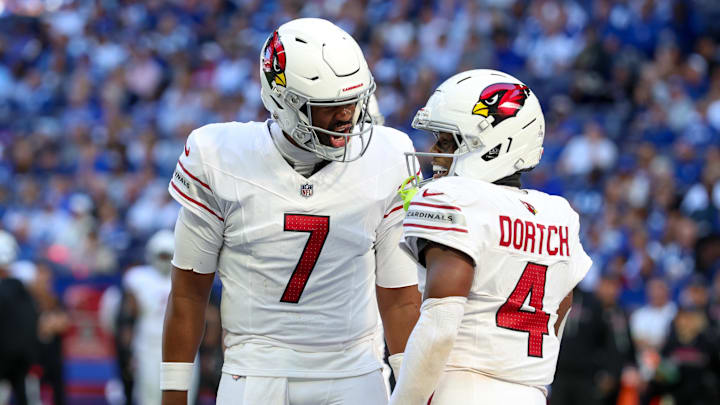 Oct 12, 2025; Indianapolis, Indiana, USA; Arizona Cardinals quarterback Jacoby Brissett (7) and wide receiver Greg Dortch (4) celebrate after scoring a touchdown against the Indianapolis Colts during the third quarter of the game at Lucas Oil Stadium. Mandatory Credit: Trevor Ruszkowski-Imagn Images