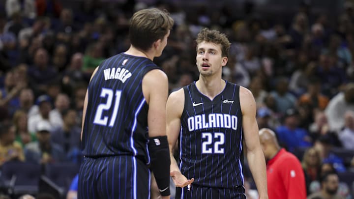 Orlando Magic center Moritz Wagner (21) speaks to forward Franz Wagner.