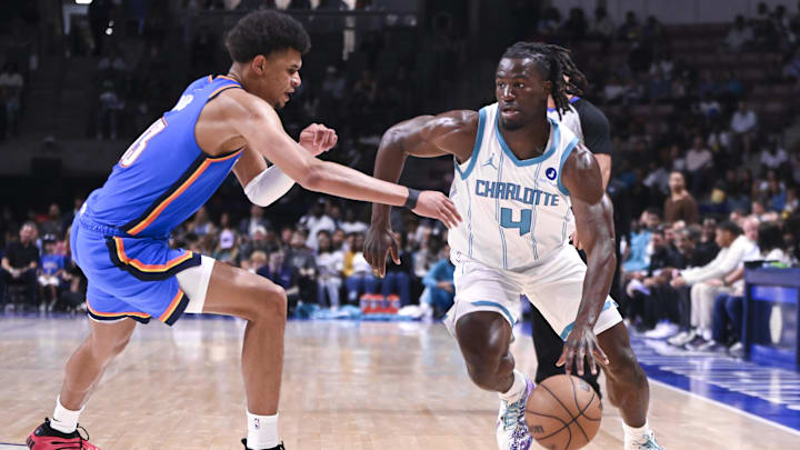 Oct 5, 2025; North Charleston, South Carolina, USA;   Charlotte Hornets guard Sion James (4) drives toward the basket in the fourth quarter at North Charleston Coliseum. Mandatory Credit: Arthur Ellis-Imagn Images