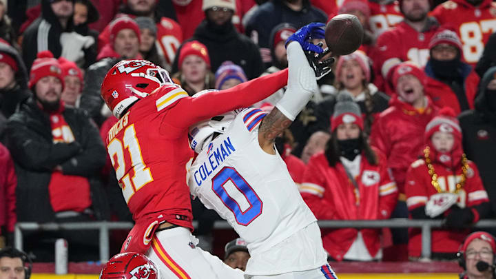 Jan 26, 2025; Kansas City, MO, USA; Buffalo Bills wide receiver Keon Coleman (0) attempts to make a catch over Kansas City Chiefs safety Jaden Hicks (21) in the AFC Championship game at GEHA Field at Arrowhead Stadium. Mandatory Credit: Denny Medley-Imagn Images
