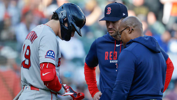 May 4, 2026; Detroit, Michigan, USA;  Boston Red Sox left fielder Roman Anthony (19) is checked on by interim manager Chad Tracy (17) and the trainer in the first inning against the Detroit Tigers at Comerica Park. Mandatory Credit: Rick Osentoski-Imagn Images