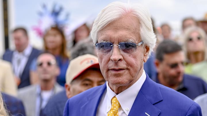 May 17, 2025; Baltimore, Maryland, USA; Bob Baffert, an American racehorse trainer, crosses the track prior to the running of the 150th Preakness stakes. Mandatory Credit: Tommy Gilligan-Imagn Images