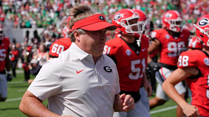 Georgia coach Kirby Smart takes the field with his team before the start of a NCAA college football game against Marshall in Athens, Ga., on Saturday, August. 30, 2025. Georgia coach Kirby Smart takes the field with his team before the start of a NCAA college football game against Marshall in Athens, Ga., on Saturday, August. 30, 2025.