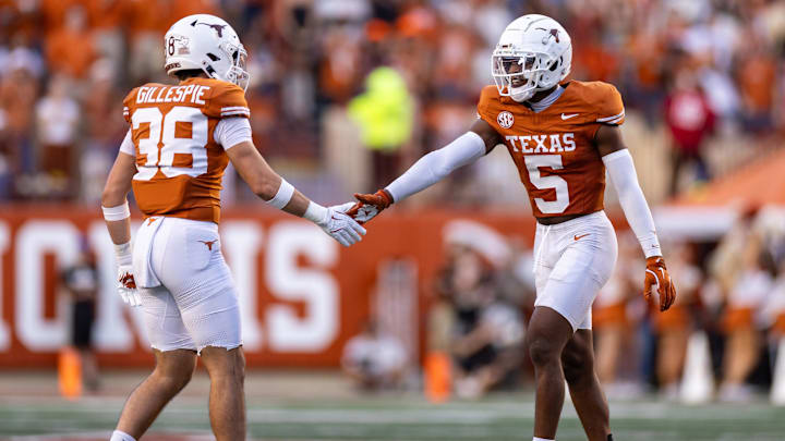 Nov 23, 2024; Austin, Texas, USA; Texas Longhorns defensive back Malik Muhammad (5) celebrates with defensive back Graham Gillespie (38) against the Kentucky Wildcats during the third quarter at Darrell K Royal-Texas Memorial Stadium. Mandatory Credit: Brett Patzke-Imagn Images Nov 23, 2024; Austin, Texas, USA; Texas Longhorns defensive back Malik Muhammad (5) celebrates with defensive back Graham Gillespie (38) against the Kentucky Wildcats during the third quarter at Darrell K Royal-Texas Memorial Stadium. Mandatory Credit: Brett Patzke-Imagn Images