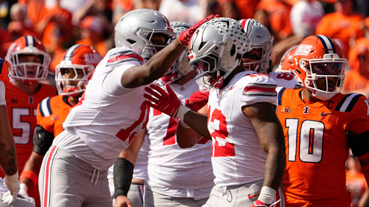 Ohio State Buckeyes tight end Jelani Thurman (15) celebrates a touchdown by running back CJ Donaldson Jr. (12) during the first half of the NCAA football game against the Illinois Fighting Illini at Gies Memorial Stadium in Champaign on Oct. 11, 2025.
