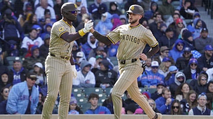 Apr 6, 2025; Chicago, Illinois, USA; San Diego Padres outfielder Jackson Merrill (3) scores and is greeted by outfielder Jason Heyward (22) against the Chicago Cubs during the eighth inning at Wrigley Field. Mandatory Credit: David Banks-Imagn Images