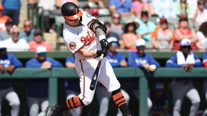Feb 27, 2025; Sarasota, Florida, USA; Baltimore Orioles outfielder Tyler O'Neill (9) hits a 3-run home run during the second inning against the Toronto Blue Jays at Ed Smith Stadium. Feb 27, 2025; Sarasota, Florida, USA; Baltimore Orioles outfielder Tyler O'Neill (9) hits a 3-run home run during the second inning against the Toronto Blue Jays at Ed Smith Stadium.