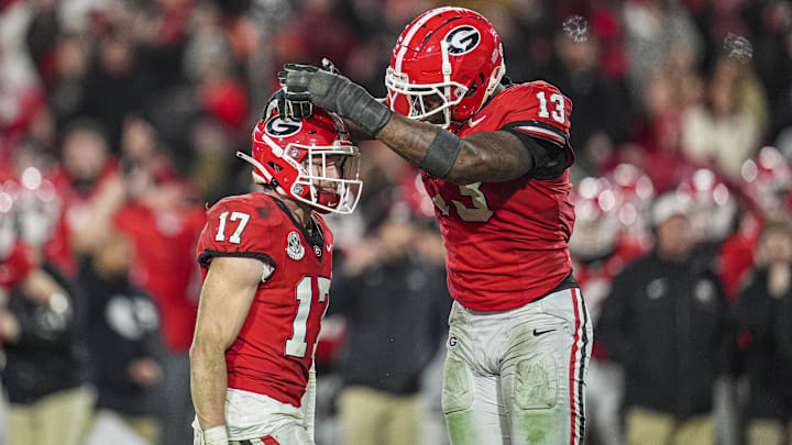 Nov 29, 2024; Athens, Georgia, USA; Georgia Bulldogs defensive back Dan Jackson (17) reacts with defensive lineman Mykel Williams (13) after sacking Georgia Tech Yellow Jackets quarterback Haynes King (10) (not pictured) during overtime at Sanford Stadium. Mandatory Credit: Dale Zanine-Imagn Images Nov 29, 2024; Athens, Georgia, USA; Georgia Bulldogs defensive back Dan Jackson (17) reacts with defensive lineman Mykel Williams (13) after sacking Georgia Tech Yellow Jackets quarterback Haynes King (10) (not pictured) during overtime at Sanford Stadium. Mandatory Credit: Dale Zanine-Imagn Images