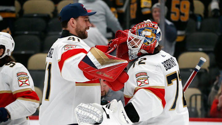 Florida Panthers goaltenders Anthony Stolarz and Sergei Bobrovsky celebrate after defeating the Pittsburgh Penguins.