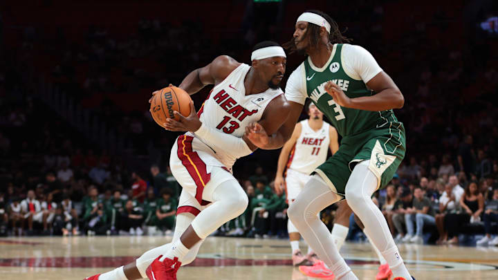 Oct 6, 2025; Miami, Florida, USA; Miami Heat center Bam Adebayo (13) drives to the basket against Milwaukee Bucks center Myles Turner (3) during the first quarter at Kaseya Center. Mandatory Credit: Sam Navarro-Imagn Images