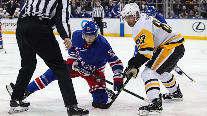 Apr 1, 2024; New York, New York, USA; New York Rangers center Barclay Goodrow (21) and Pittsburgh Penguins center Sidney Crosby (87) battle after a face-off during the second period at Madison Square Garden. Mandatory Credit: Danny Wild-Imagn Images