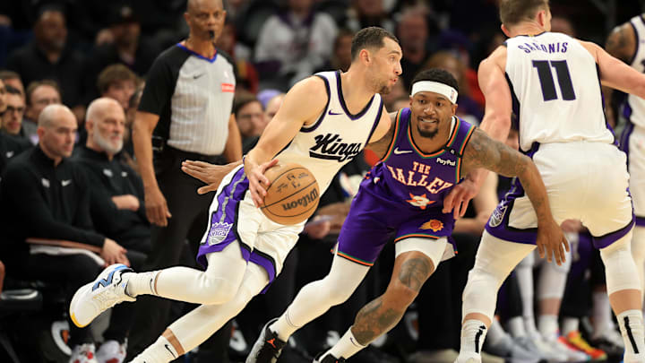 Mar 14, 2025; Phoenix, Arizona, USA; Sacramento Kings guard Zach LaVine (8) dribbles the ball against Phoenix Suns guard Bradley Beal (3) during the first half at Footprint Center. Mandatory Credit: Mark J. Rebilas-Imagn Images