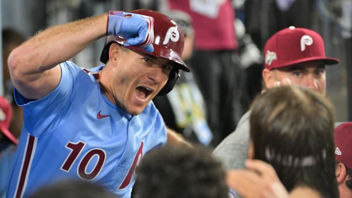 Oct 8, 2025; Los Angeles, California, USA; Philadelphia Phillies catcher J.T. Realmuto (10) celebrates after hitting a solo home run during the eighth inning against the Los Angeles Dodgers during game three of the NLDS round for the 2025 MLB playoffs at Dodger Stadium. Mandatory Credit: Jayne Kamin-Oncea-Imagn Images