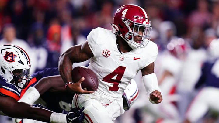 Nov 25, 2023; Auburn, Alabama, USA; Alabama Crimson Tide quarterback Jalen Milroe (4) scrambles out of the pocket against the Auburn Tigers during the fourth quarter at Jordan-Hare Stadium. Mandatory Credit: John David Mercer-Imagn Images Nov 25, 2023; Auburn, Alabama, USA; Alabama Crimson Tide quarterback Jalen Milroe (4) scrambles out of the pocket against the Auburn Tigers during the fourth quarter at Jordan-Hare Stadium. Mandatory Credit: John David Mercer-Imagn Images
