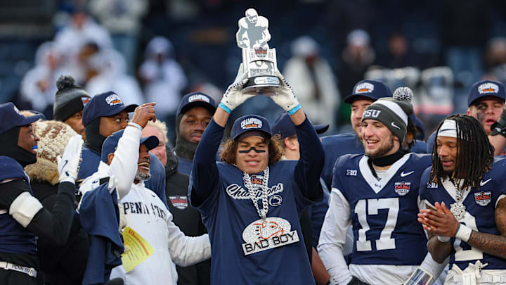 Dec 27, 2025; Bronx, NY, USA; Penn State Nittany Lions wide receiver Trebor Pena (8) holds the David C. Koch MVP Trophy after defeating the Clemson Tigers in the 2025 Pinstripe Bowl at Yankee Stadium. Mandatory Credit: Vincent Carchietta-Imagn Images