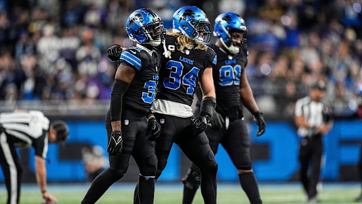 From left, Detroit Lions safety Kerby Joseph (31), linebacker Alex Anzalone (34), and defensive end Levi Onwuzurike (91) walk off the field after a play against Minnesota Vikings during the second half at Ford Field in Detroit on Sunday, Jan. 5, 2025.
