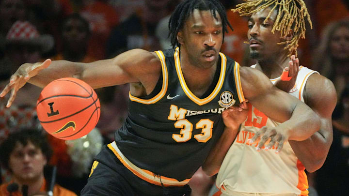 Missouri's Josh Gray (33) tries to get past Tennessee's Jahmai Mashack (15) in an NCAA college basketball game on Wednesday, Feb. 5, 2025, in Knoxville, Tenn.