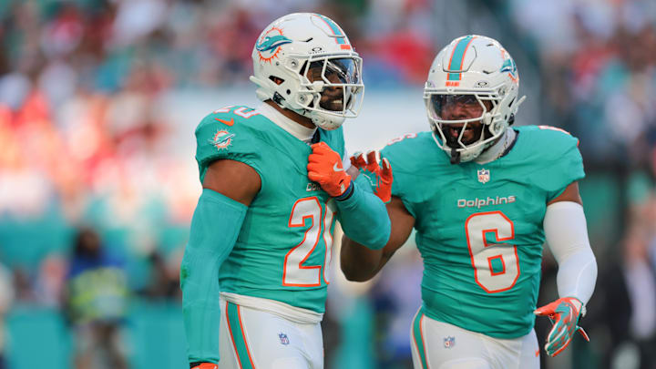 Miami Dolphins linebacker Jordyn Brooks (20) celebrates with linebacker Anthony Walker Jr. (6) after sacking San Francisco 49ers quarterback Brock Purdy (not pictured) during the first quarter at Hard Rock Stadium. 