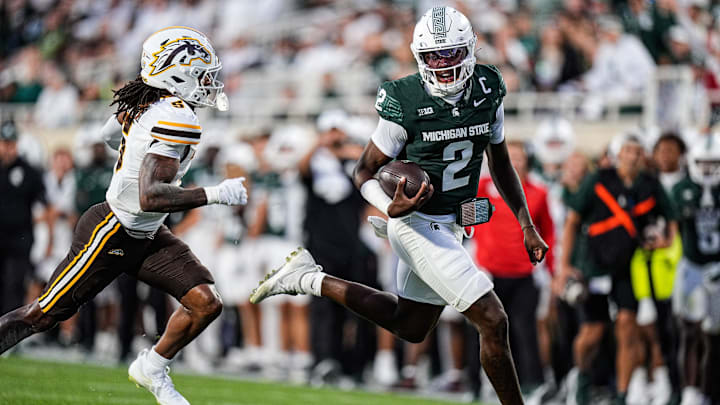 Michigan State quarterback Aidan Chiles (2) runs against Western Michigan safety Aaron Wofford (5) during the first half at Spartan Stadium in East Lansing on Friday, August 29, 2025.