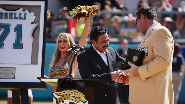 Hall of fame football tackle Tony Boselli shakes hands with Jaguars owner Shad Khan as he was honored at halftime with his Jacksonville Jaguars number 71 retired. Boselli was enshrined in Canton, Ohio this past August after his seven season career all with the Jaguars. The honor took place during between the Jacksonville Jaguars and the Houston Texans of an NFL football game Sunday, Oct. 9, 2022 at TIAA Bank Field in Jacksonville. [Corey Perrine/Florida Times-Union]

Jki 100822 Texans Jags Cp 16