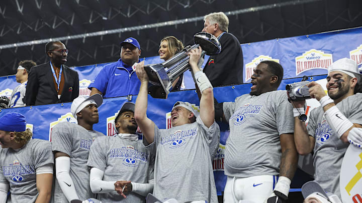 BYU players celebrate winning the Alamo Bowl over Colorado.