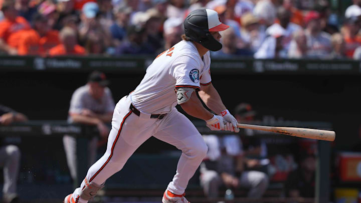 Sep 19, 2024; Baltimore, Maryland, USA; Baltimore Orioles second baseman Jackson Holliday (7) drives in two runs on his fourth inning double against the San Francisco Giants at Oriole Park at Camden Yards.