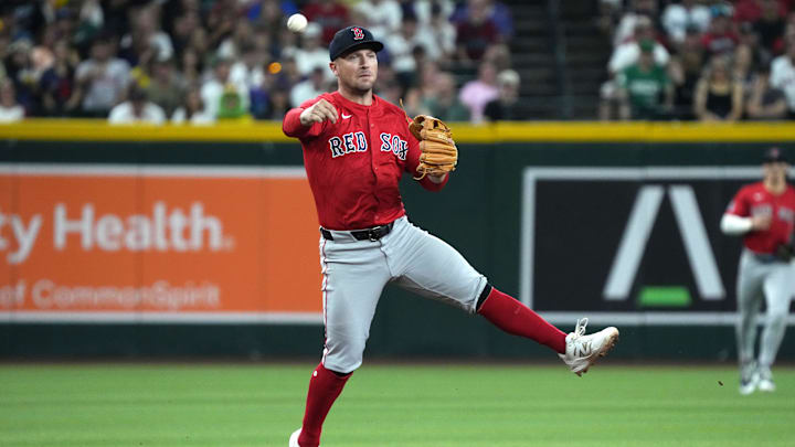 Sep 5, 2025; Phoenix, Arizona, USA; Boston Red Sox third base Alex Bregman (2) mkaes the off balance throw for an out against the Arizona Diamondbacks in the first inning at Chase Field. Mandatory Credit: Rick Scuteri-Imagn Images