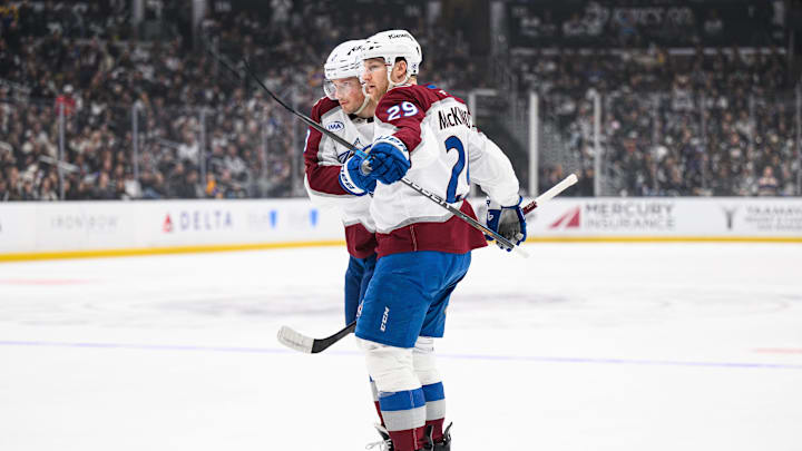 Apr 26, 2026; Los Angeles, California, USA; Colorado Avalanche center Nathan MacKinnon (29) is greeted by defenseman Cale Makar (8) after scoring during the first period in game four of the first round of the 2026 Stanley Cup Playoffs against the Los Angeles Kings at Crypto.com Arena. Mandatory Credit: William Liang-Imagn Images