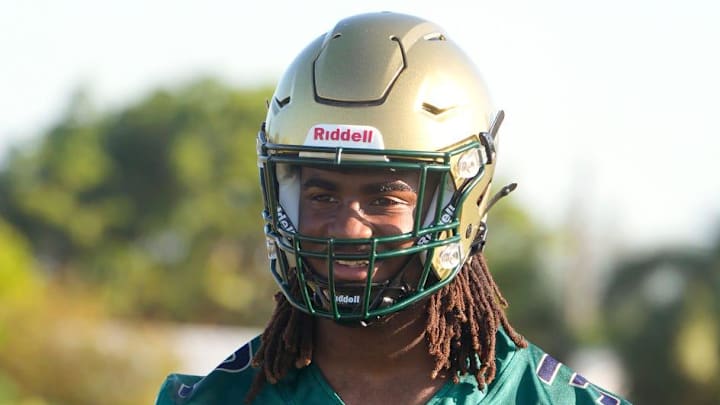 Jayden Petit prepares for a football drill during practice. The St. John Neumann High School football team held practice Tuesday morning July 29, 2025.