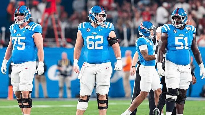 Ole Miss offensive linemen Patrick Kutas (75), Brycen Sanders (62) and Delano Townsend (51) ahead of a snap against Miami in the College Football Playoff Fiesta Bowl semifinal (2026). 