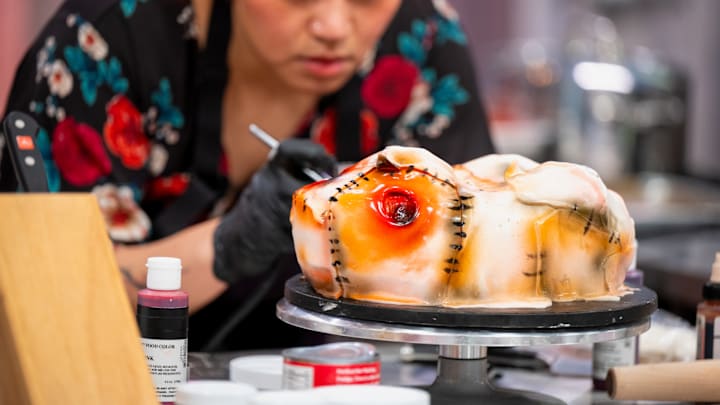Contestant Megan Aucone, baking process, as seen on Halloween Baking Championship, Season 10.