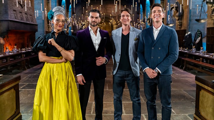 Judges Carla Hall and Jozef Youssef with Hosts James and Oliver Phelps in The Great Hall, as seen on Harry Potter: Wizards of Baking, Season 1.