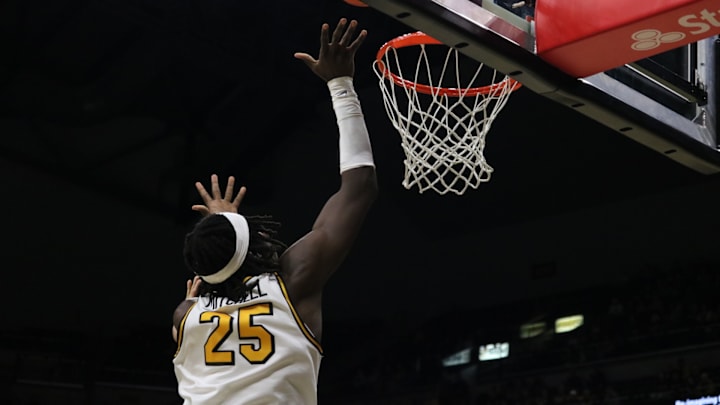 Nov. 8, 2024; Columbia, Missouri, USA; Missouri Tigers forward Mark Mitchell (25) finishes at the rim against the Howard Bison. 