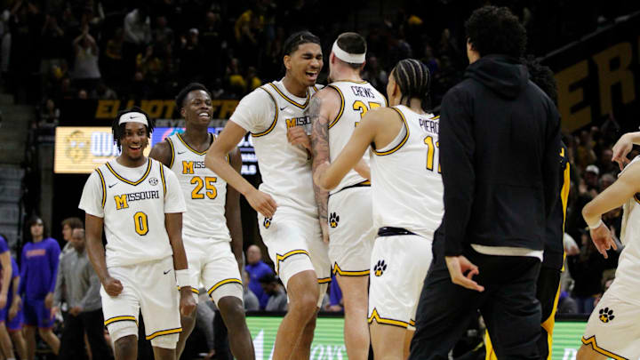 Jan 3, 2026; Columbia, Missouri, USA; Missouri Tigers center Trent Burns (7) celebrates his last-second shot at the end of the first half at Mizzou Arena. Jan 3, 2026; Columbia, Missouri, USA; Missouri Tigers center Trent Burns (7) celebrates his last-second shot at the end of the first half at Mizzou Arena.