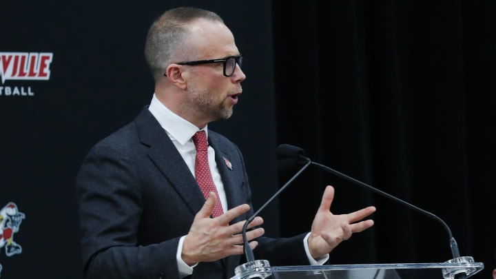 New Louisville basketball head coach Pat Kelsey, left, made remarks during his announcement as