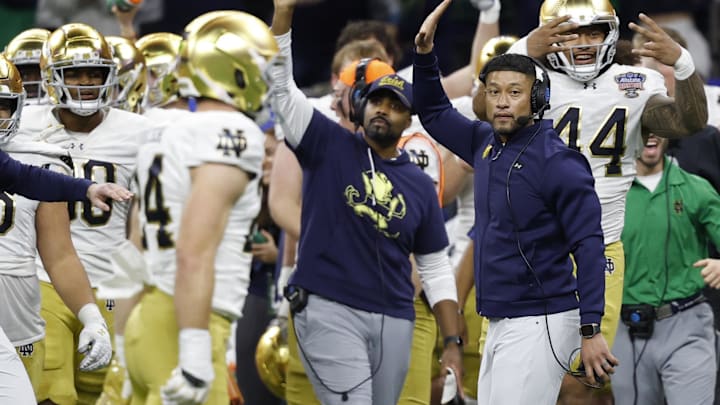Jan 2, 2025; New Orleans, LA, USA; Notre Dame Fighting Irish head coach Marcus Freeman celebrates on the sidelines in the final minute against the Georgia Bulldogs during the fourth quarter at Caesars Superdome. Mandatory Credit: Geoff Burke-Imagn Images