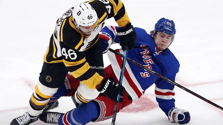 Mar 27, 2019; Boston, MA, USA; Boston Bruins center David Krejci (46) knocks down New York Rangers center Lias Andersson (50) during the first period at TD Garden. Mandatory Credit: Winslow Townson-Imagn Images Mar 27, 2019; Boston, MA, USA; Boston Bruins center David Krejci (46) knocks down New York Rangers center Lias Andersson (50) during the first period at TD Garden. Mandatory Credit: Winslow Townson-Imagn Images