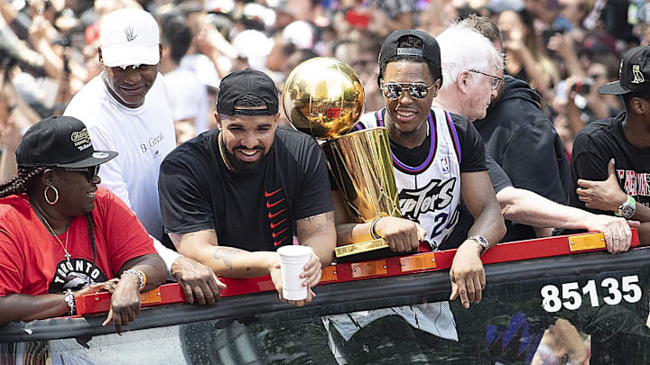 Jun 17, 2019; Toronto, Ontario, Canada; Canadian recording artist Drake sits beside Toronto Raptors guard Kyle Lowry at Toronto Raptors Championship Parade. Mandatory Credit: Nick Turchiaro-USA TODAY Sports